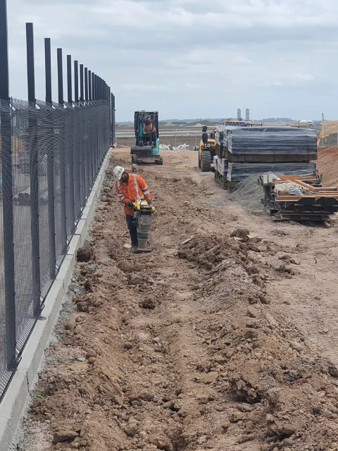 Compacting trench lines of earth grid installation