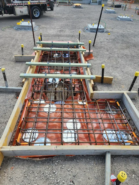 Embedded welding of circuit breaker structure footing