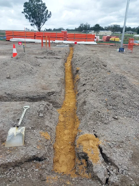 Sand backfill of trench lines